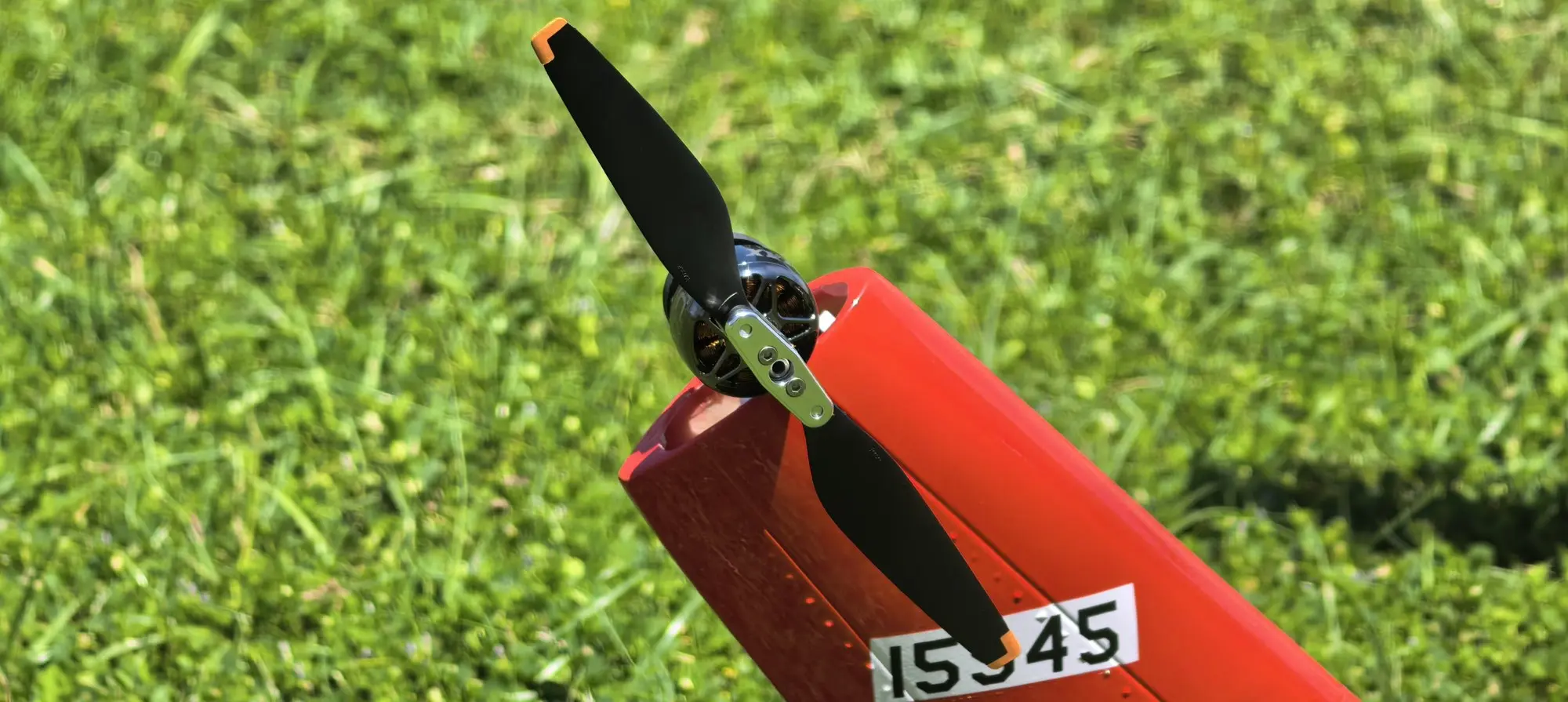Tail rotor and red tail fin with 15945 markings on the FLISHRC AH-1 Cobra RC helicopter